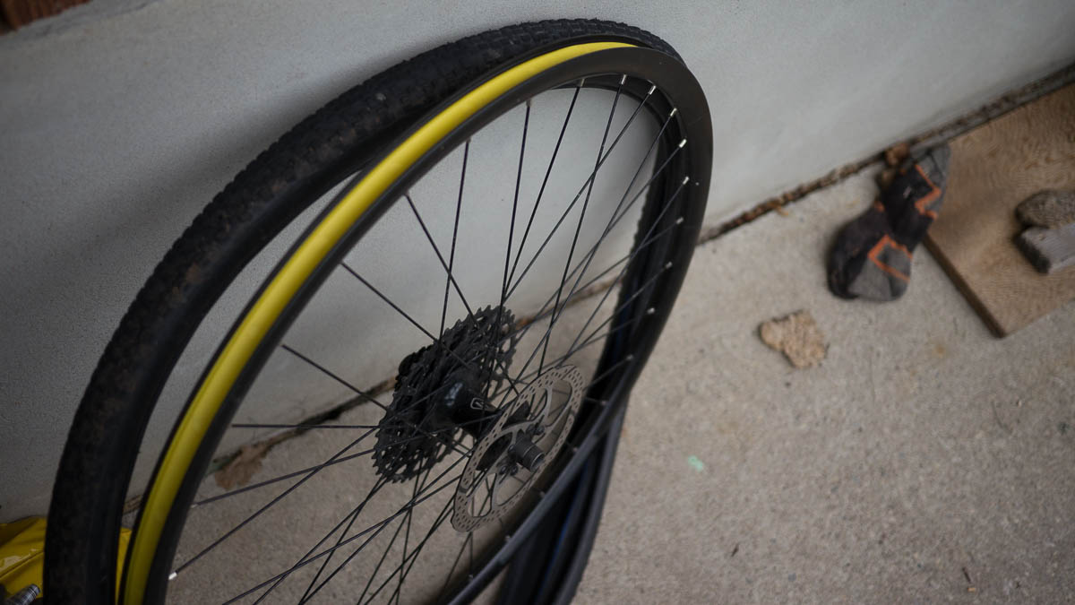 Tire being removed from the rim.
