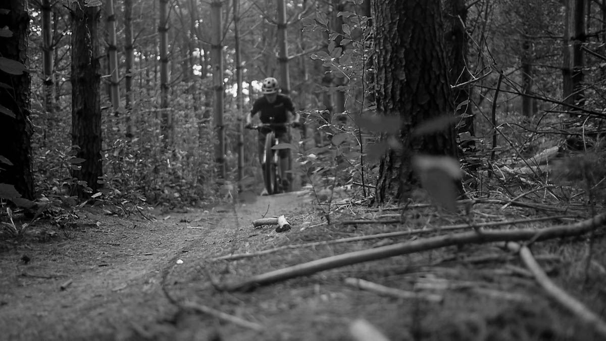 A cyclist riding toward us.