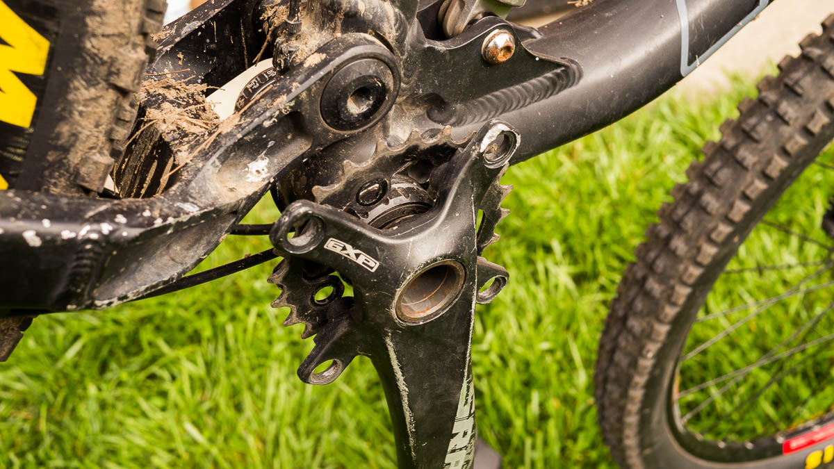The unscrewed small chainring captive behind the cranks.
